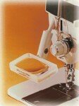 Magnifier with sewing machine attachment