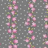 Pink flowers on grey dotty background